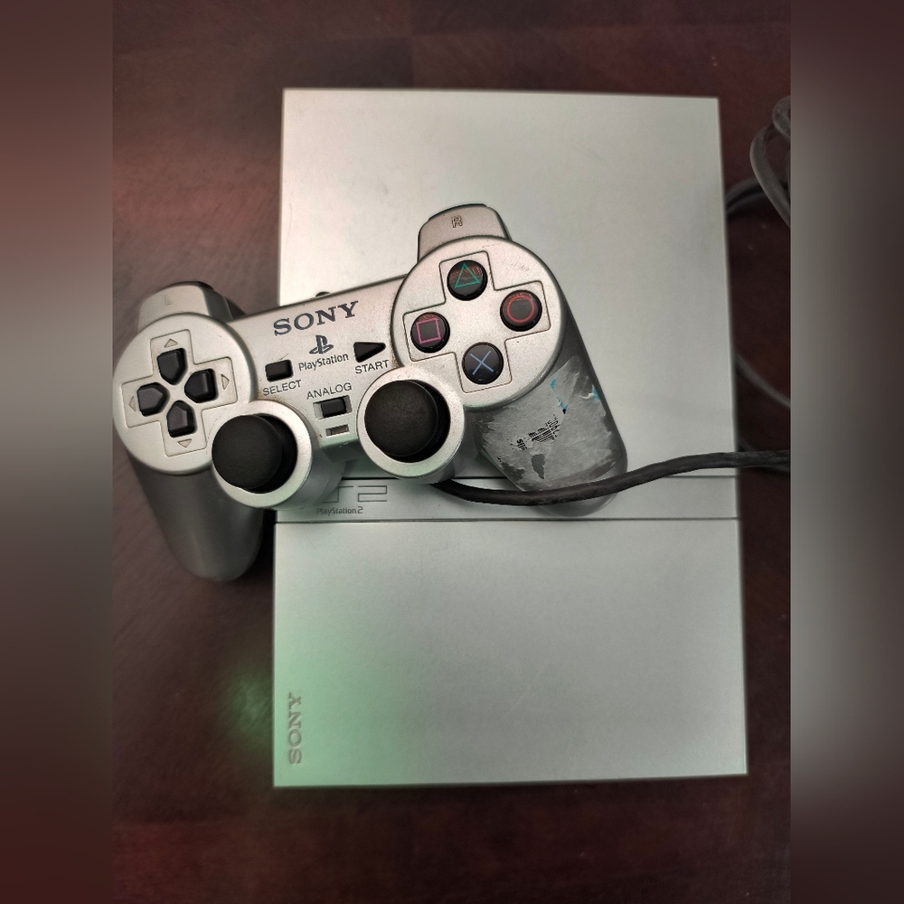 Sony Playstation 2 slim silver with 3 games and controller